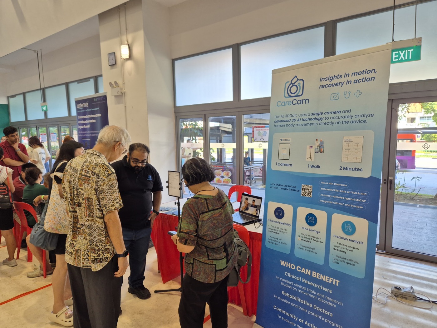 Residents at a CareCam mobility screening booth.